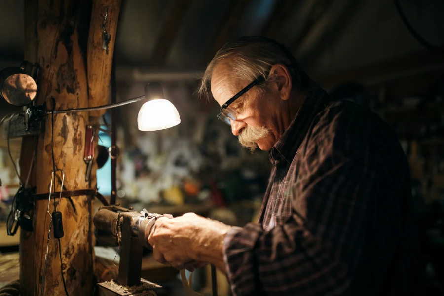 Old American man working with wood | Acme Duplex